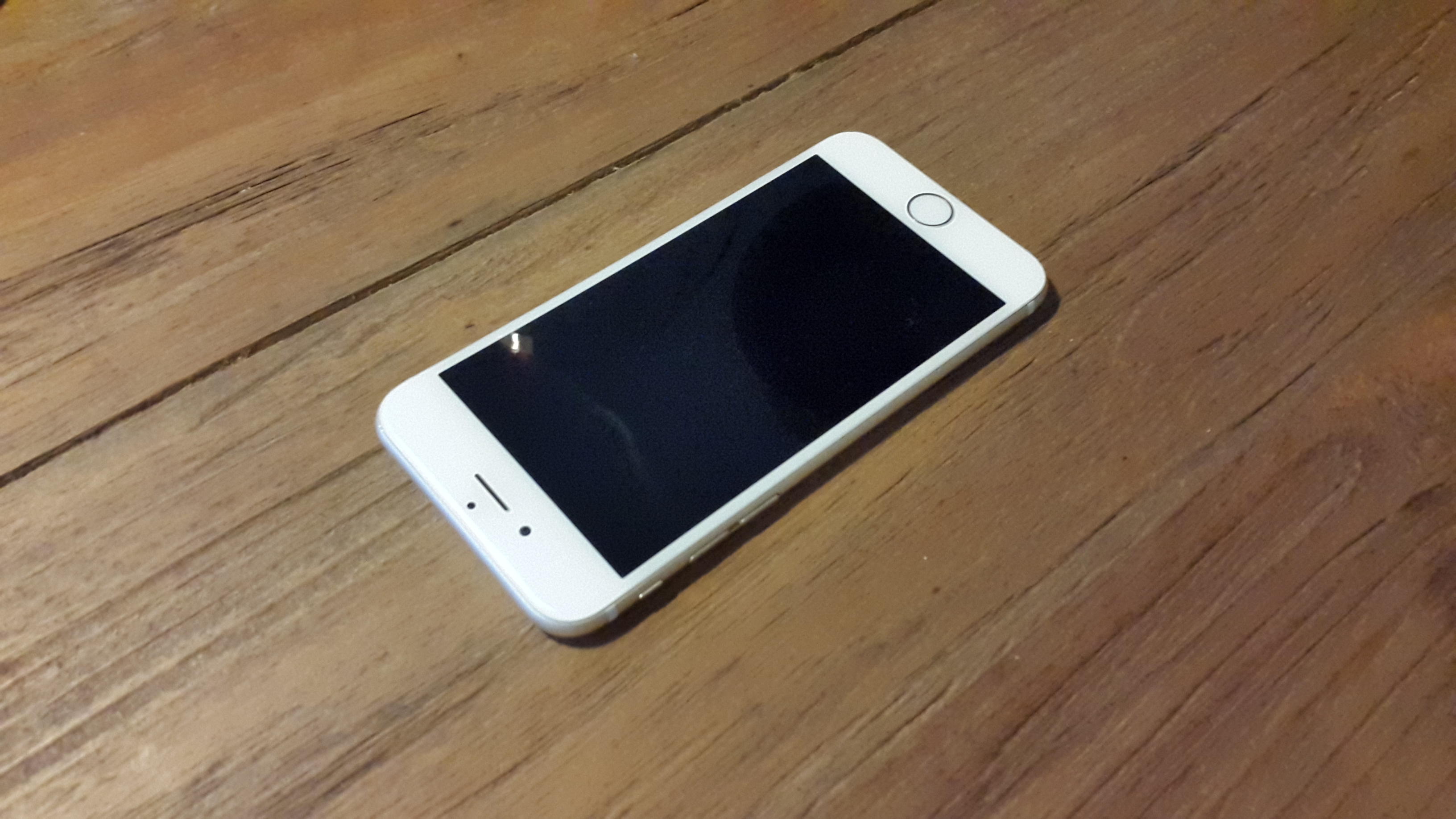 A smartphone lying on a table; contextual image